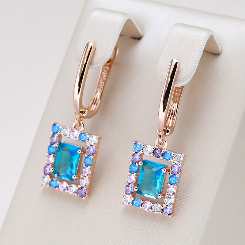 Boucles d'oreilles élégantes en cristal cubique bleu en or