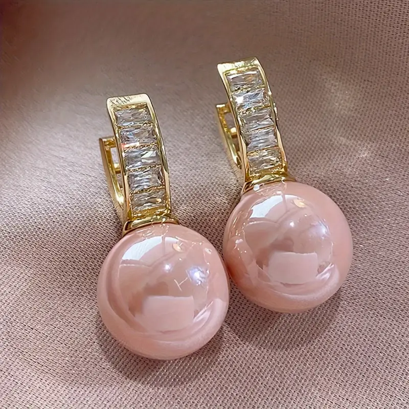 Boucles d'oreilles en or avec zirconium rose