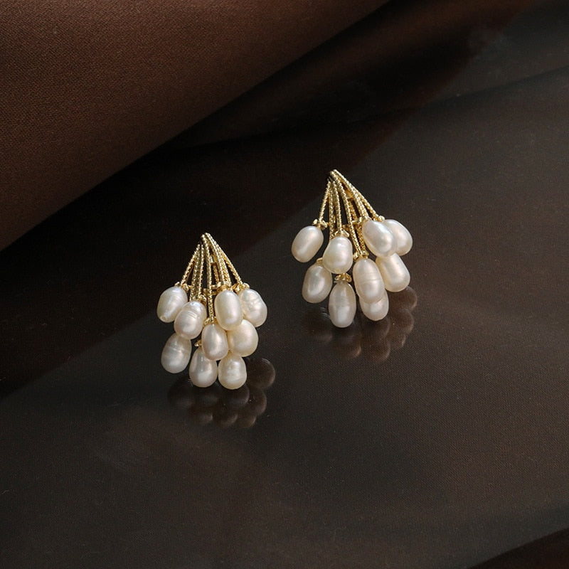 Boucles d'oreilles en corail avec des perles d'eau douce