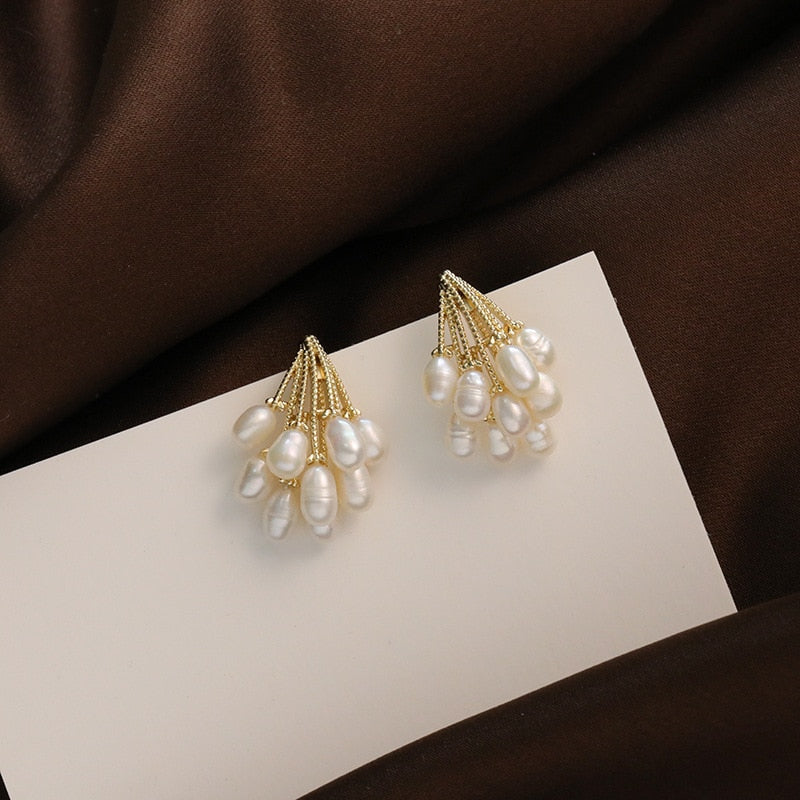 Boucles d'oreilles en corail avec des perles d'eau douce