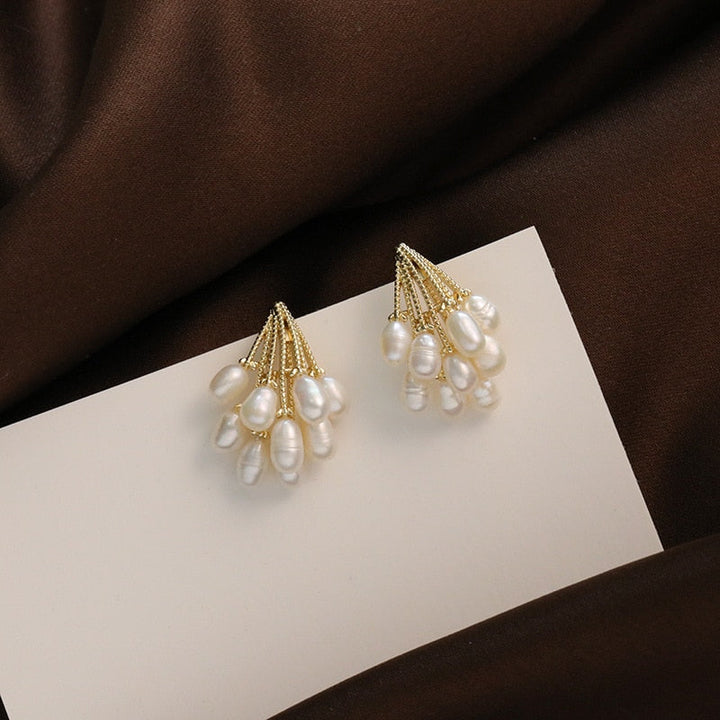 Boucles d'oreilles en corail avec des perles d'eau douce