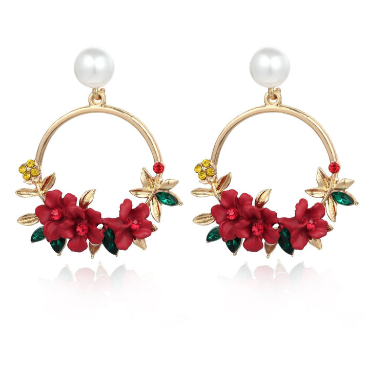 Boucles d'oreilles en fleurs et perles dorées