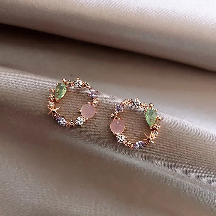 Boucles d'oreilles florales avec zirconia en or